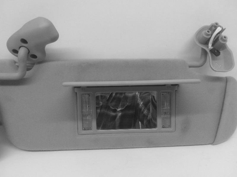 Used Left Sun Visor fits: 2006 Chevrolet Suburban 1500 illuminated Lef