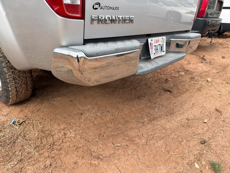 Used Rear Bumper Assembly Rear fits: 2013 Nissan Frontier chrome w/o p