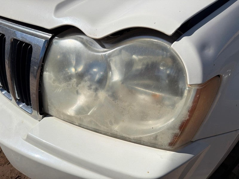 Used Left Headlight Assembly fits: 2005 Jeep Grand cherokee Left Grade