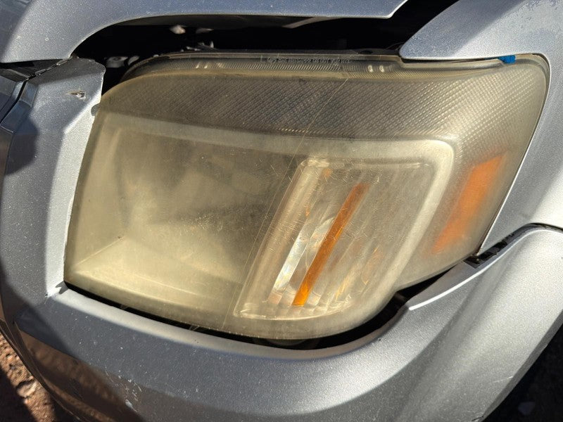 Used Left Headlight Assembly fits: 2010 Mercury Mariner Left Grade A