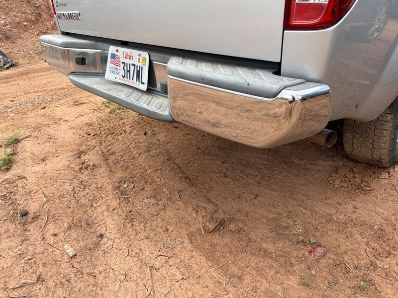 Used Rear Bumper Assembly Rear fits: 2013 Nissan Frontier chrome w/o p