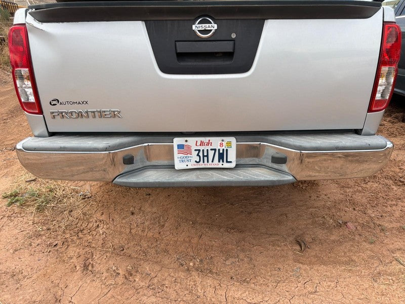 Used Rear Bumper Assembly Rear fits: 2013 Nissan Frontier chrome w/o p