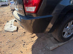 Used Rear Bumper Assembly Rear fits: 2005 Jeep Grand cherokee w/o chro