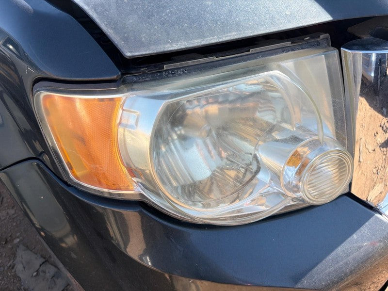 Used Right Headlight Assembly fits: 2008 Ford Escape clear background 