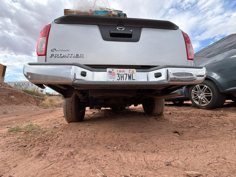 Used Rear Bumper Assembly Rear fits: 2013 Nissan Frontier chrome w/o p