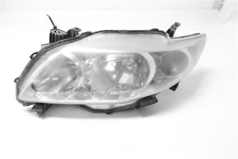 Used Left Headlight Assembly fits: 2010 Toyota Corolla L. w/o black tr