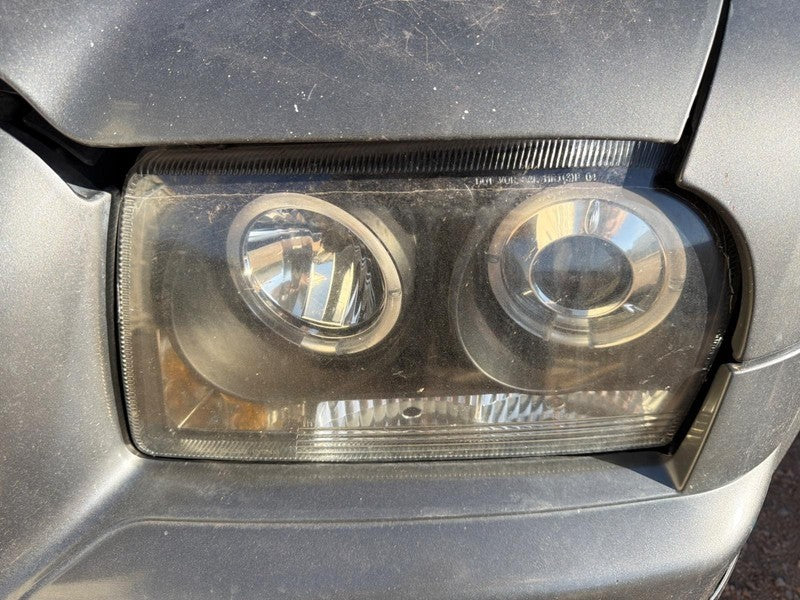 Used Left Headlight Assembly fits: 2009 Chrysler 300 halogen w/o proje