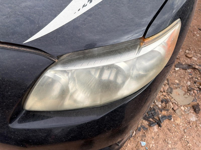Used Left Headlight Assembly fits: 2010 Toyota Corolla L. w/o black tr